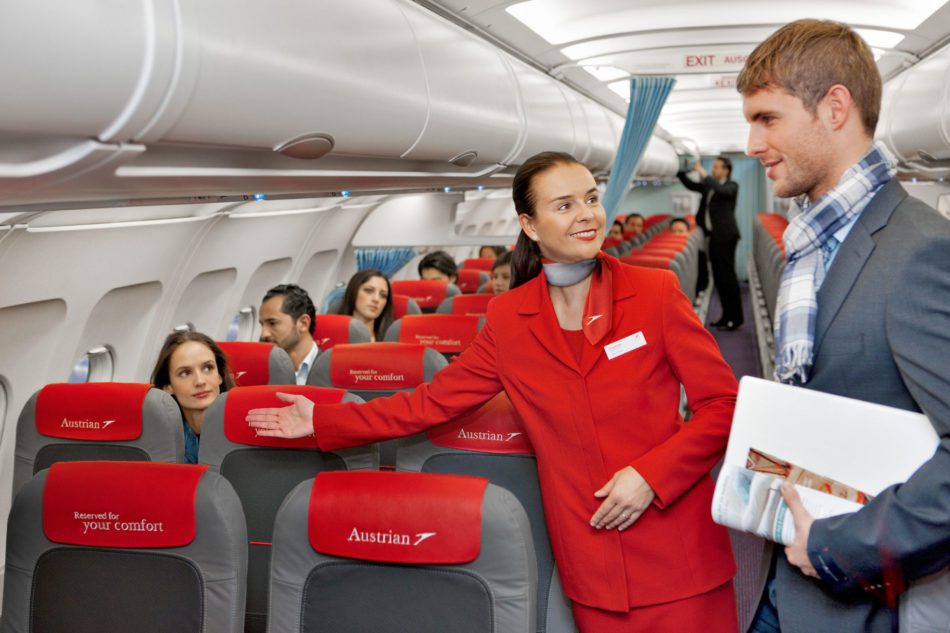 Flight attendant helping a passenger